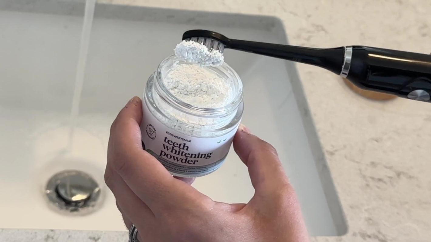 Step 1: Toothbrush dipped into Ecosweetsmile whitening powder with powder on bristles