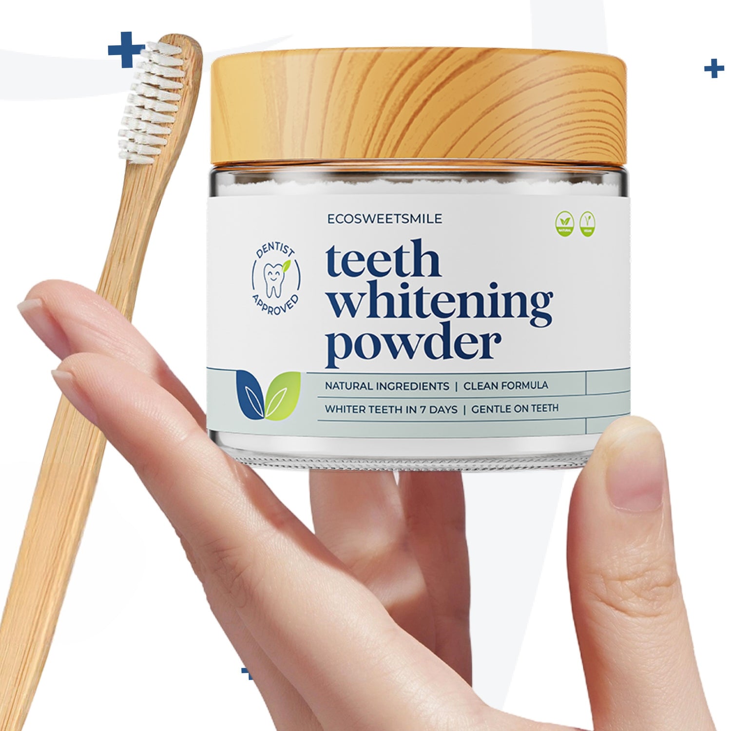 Ecosweetsmile teeth whitening powder held by fingertips with bamboo toothbrush on left